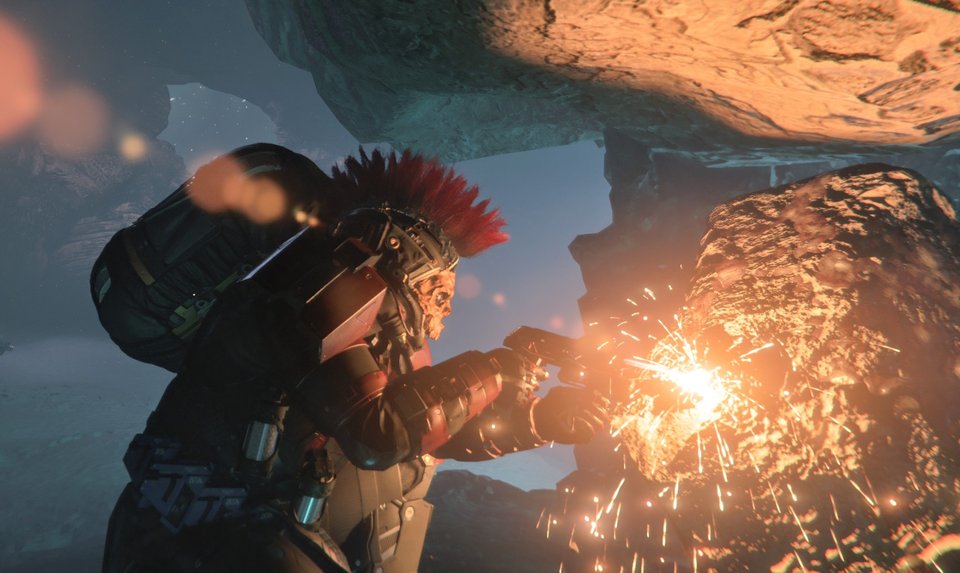 Miner cutting an ore face with bright sparks inside an ice cave