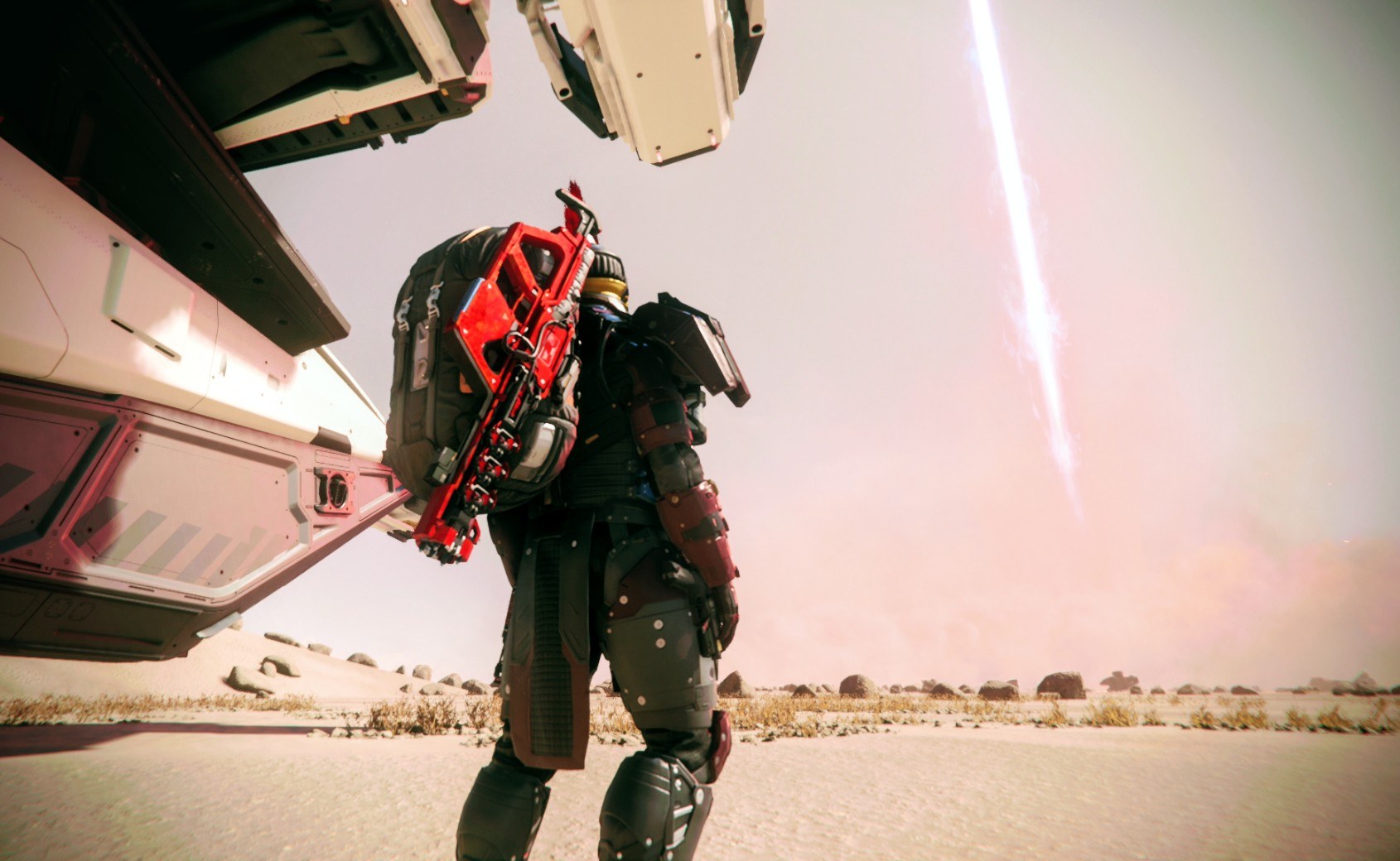 Armored explorer on desert world under falling streak of light
